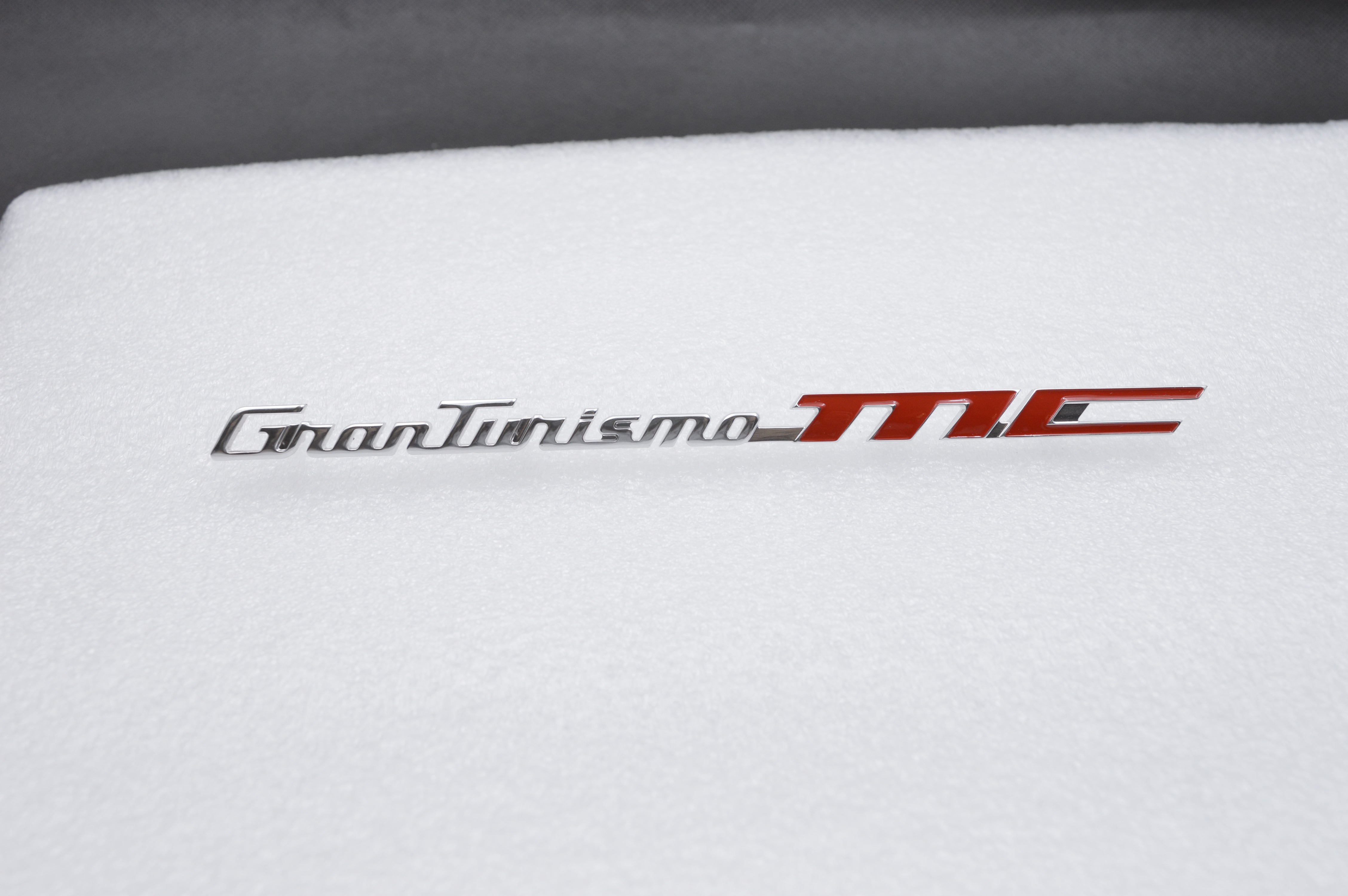 Genuine Maserati GranTurismo MC Dashoard Passenger Side badge emblem 84303900 Factory