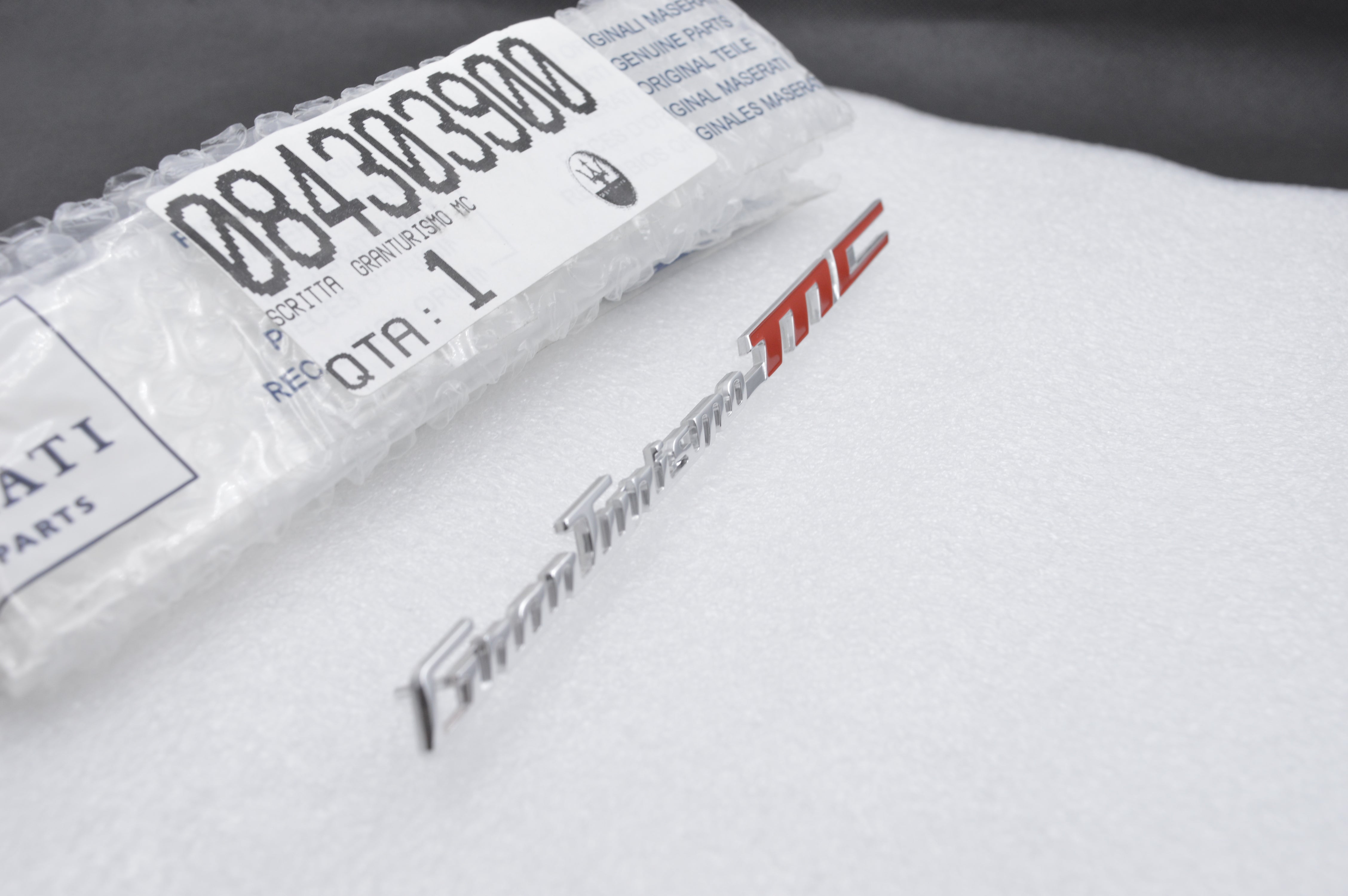 Genuine Maserati GranTurismo MC Dashoard Passenger Side badge emblem 84303900 Factory